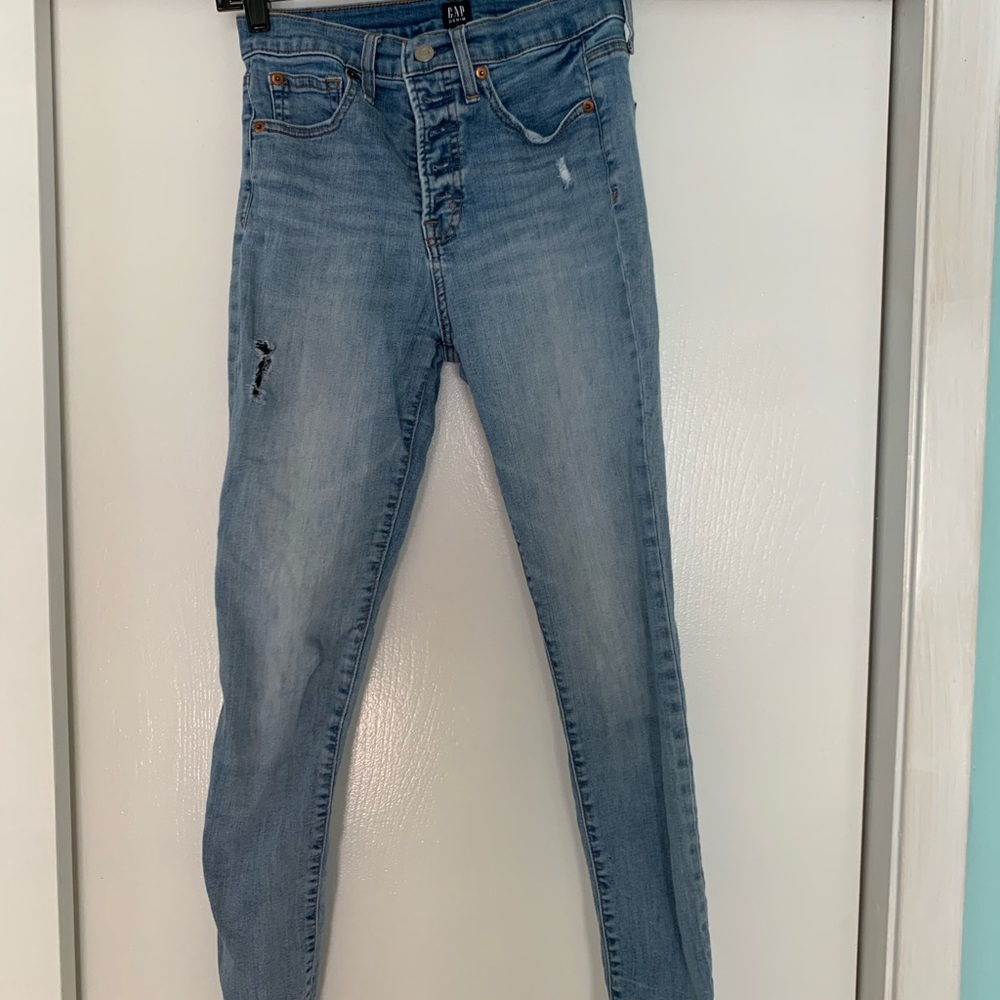 Button fly distressed denim